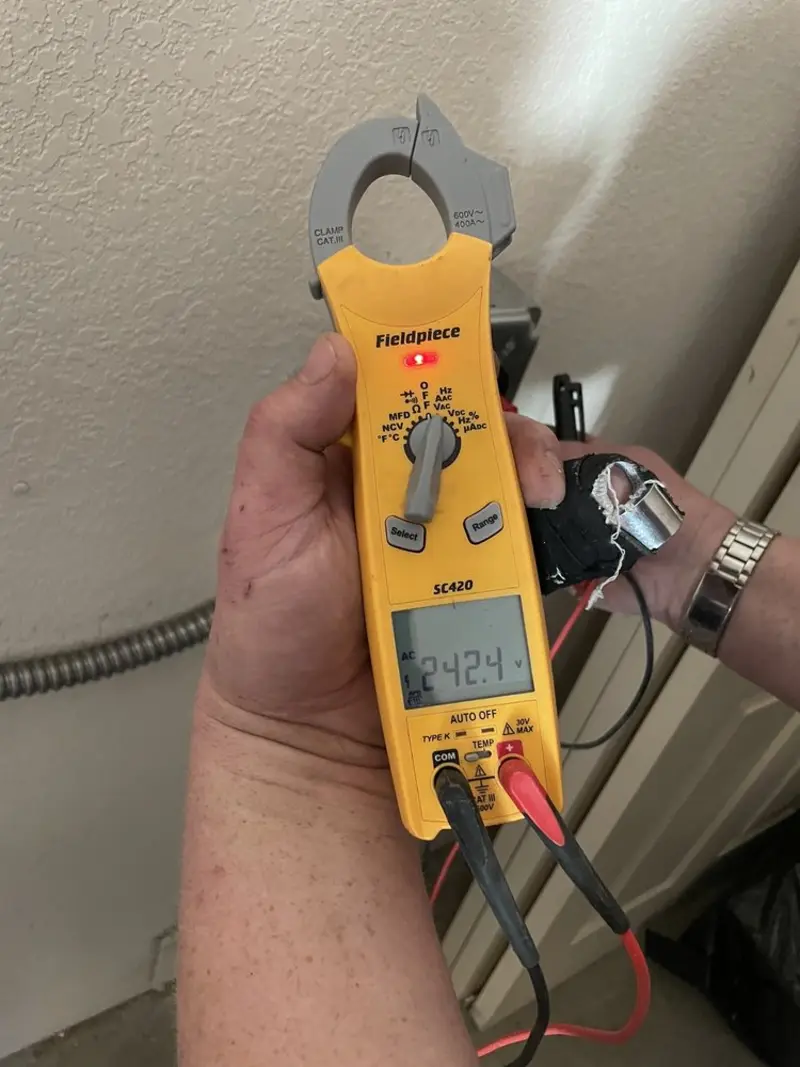 Voltage testing with clamp meter during Outlet Installation in Upper St. Clair